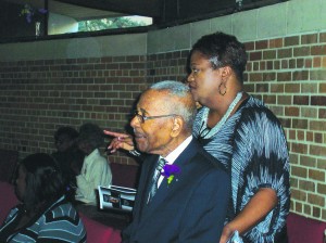 Reverend Smith with Brenda Johnson, a member of Wayman AME Church Photo by Jamal Denman 